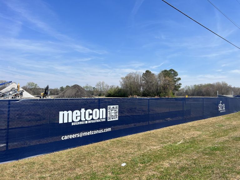 9 oz mesh fence wrap with contractor logo and QR code