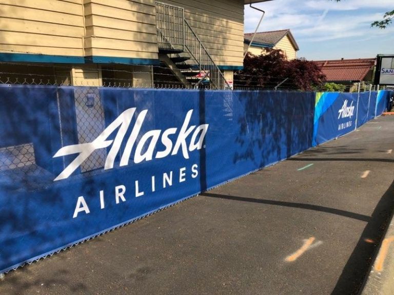 Full-color printed fence wrap around an airport construction project