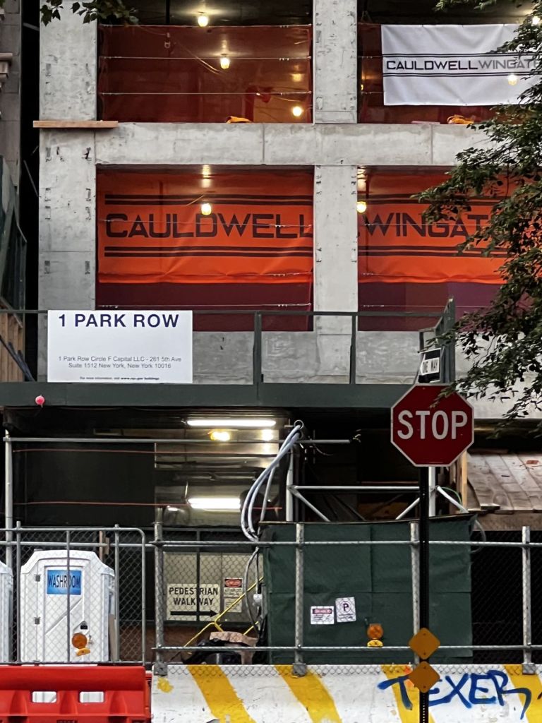 Orange printed Cauldwell Wingate netting on floors of a New York building