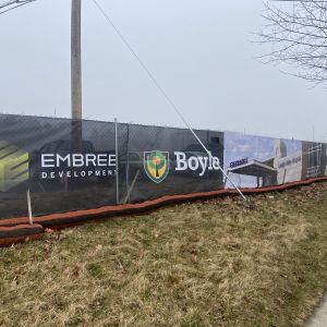Embree Development and Boyle printed construction fence banner with project rendering