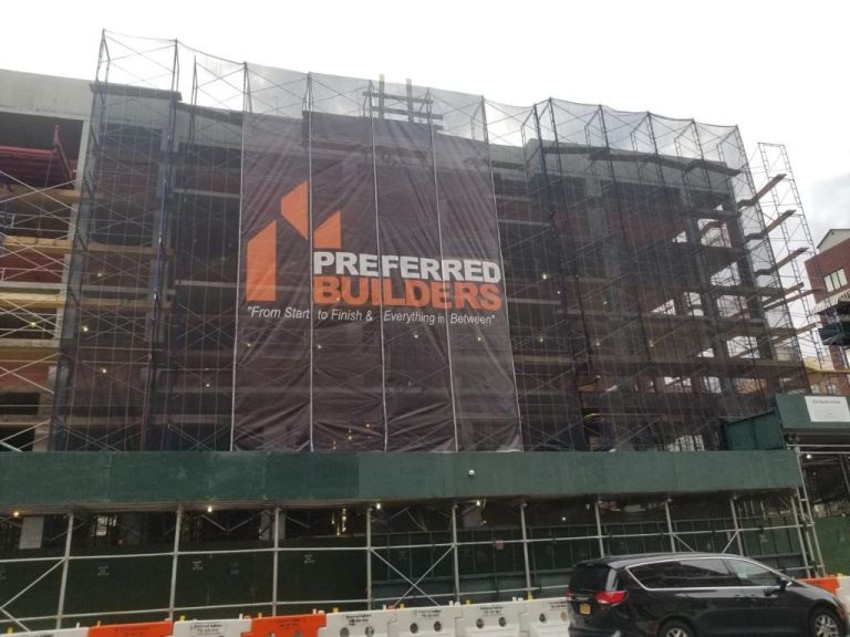 Printed mesh scaffold wrap on a building under construction