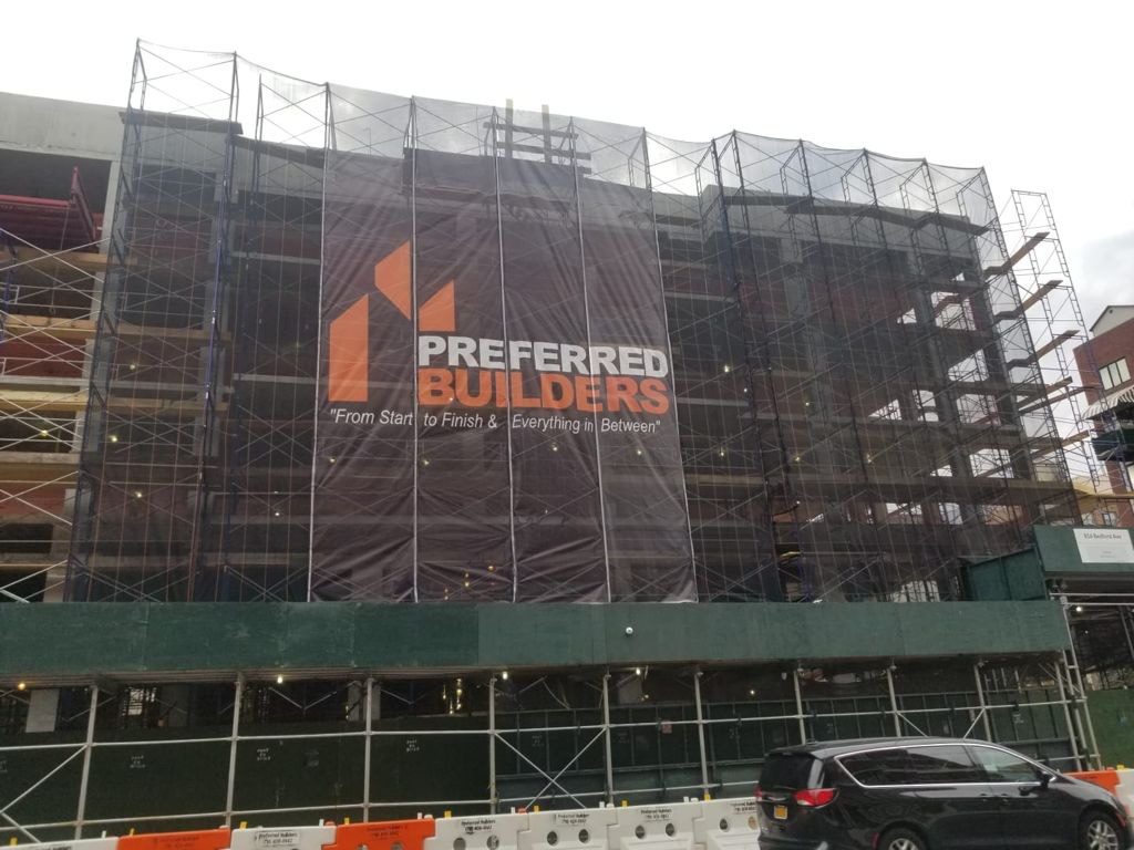 Preferred Builders printed mesh wrap on building scaffolding